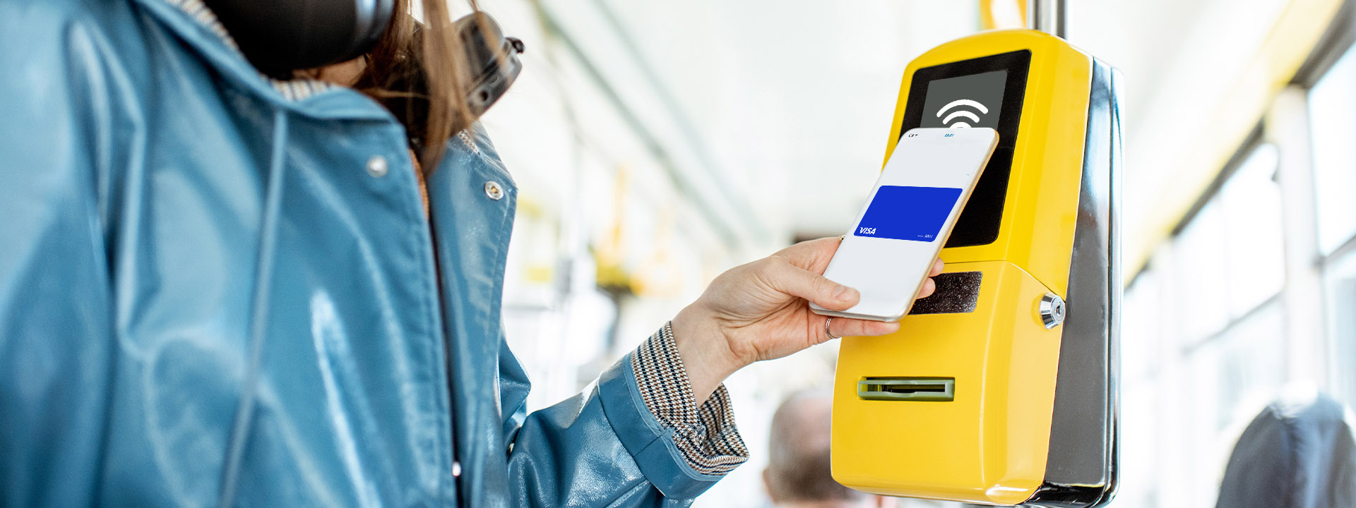 a person using a phone to pay for a ticket