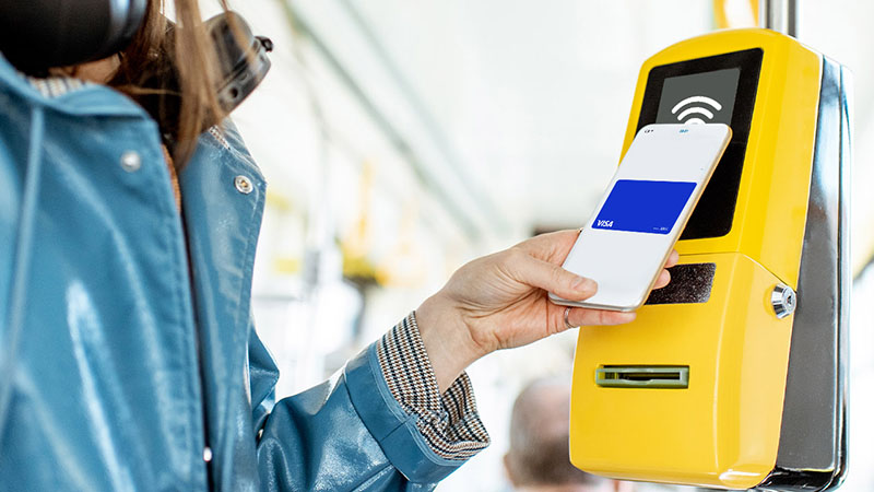 a person using a phone to pay for a ticket