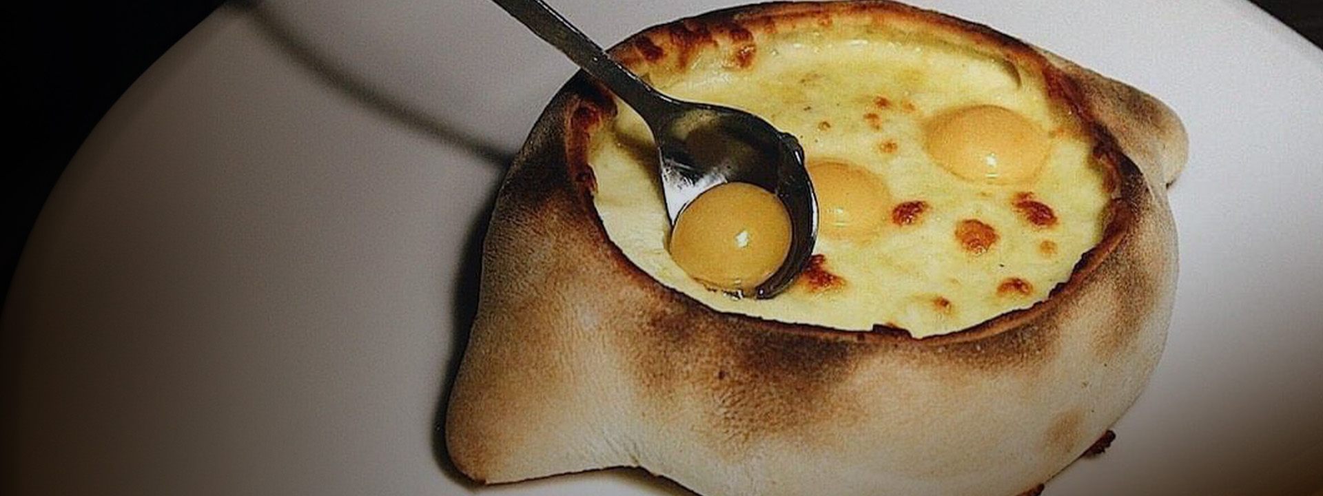 Khachapuri with three eggs