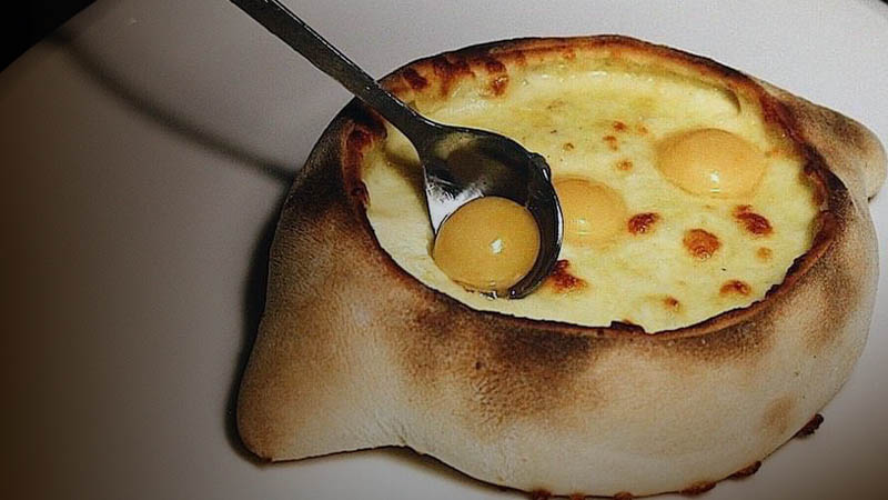 Khachapuri with three eggs