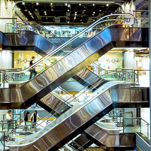 modern escalators inside a building