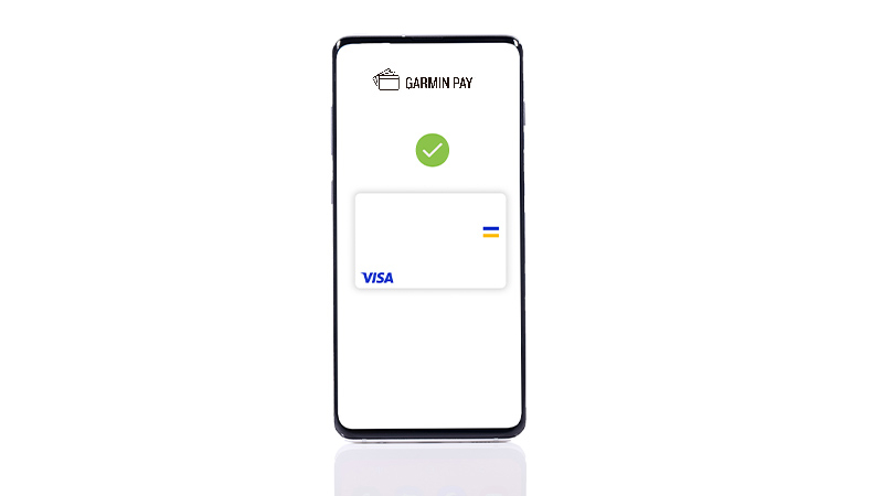 A smartphone with a Garmin Pay logo and a Visa card on a screen